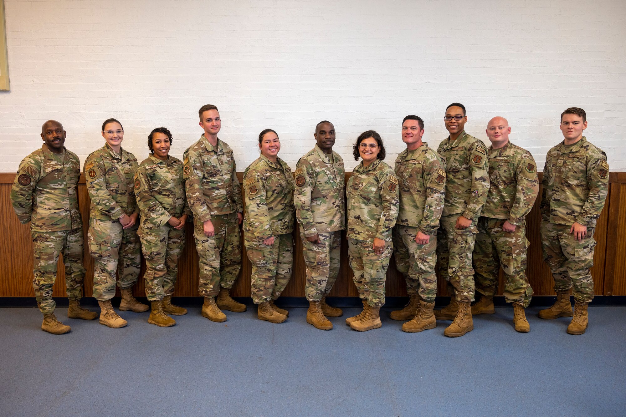 U.S. Air Force Chief Master Sgt. Maurice Williams, center, command chief, Air National Guard poses for a group photo with Airmen of the 131st Bomb Wing, Missiouri National Guard, during his visit at Jefferson Barracks Air National Guard Base, St. Louis, Missouri, Sept. 11, 2022. Over lunch, Williams spoke with the Airmen about the importance of the mission, leadership qualities and the Airmen's impact on the future of the Air Force. (U.S. Air National Guard photo by Senior Airman Whitney Erhart)