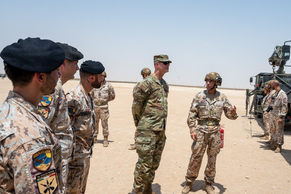 U.S. Air Force Lt. Gen. Alexus G. Grynkewich, center, Ninth Air Force (Air Forces Central) commander, is briefed on a theater-level air defense system by Italian Air Force members at IAF base camp on Ali Al Salem Air Base, Kuwait, Aug. 18, 2022.