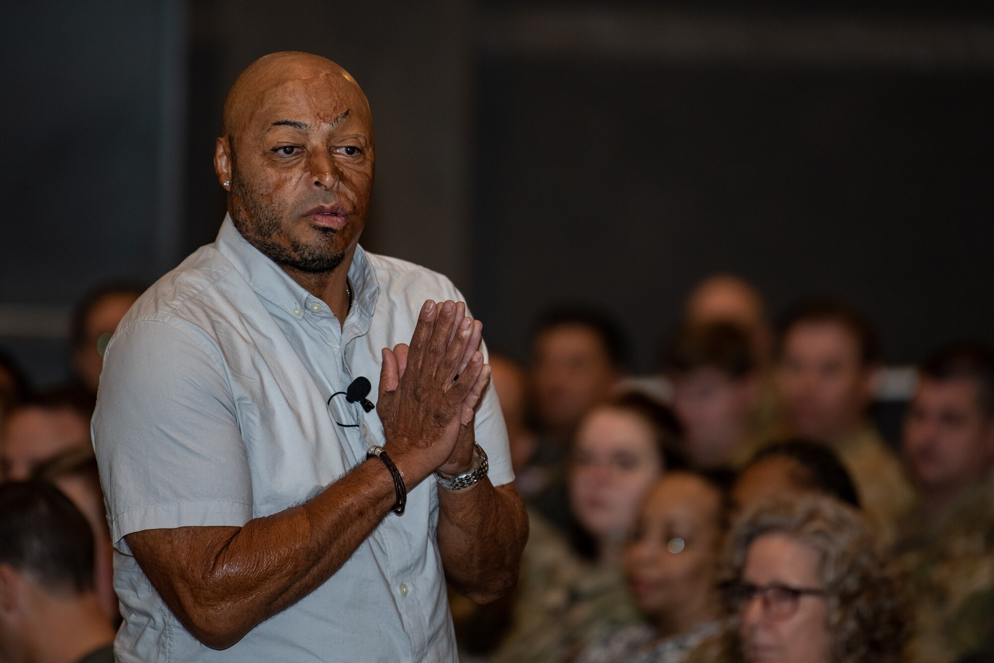 J.R. Martinez, a combat veteran and motivational speaker, speaks to the 317th Airlift Wing during a resiliency training day at Dyess Air Force Base, Texas, Sept. 23, 2022. Martinez spoke about his journey of recovery after a landmine explosion left him injured during his deployment in Iraq, 2003. (U.S. Air Force photo by Airman 1st Class Ryan Hayman)