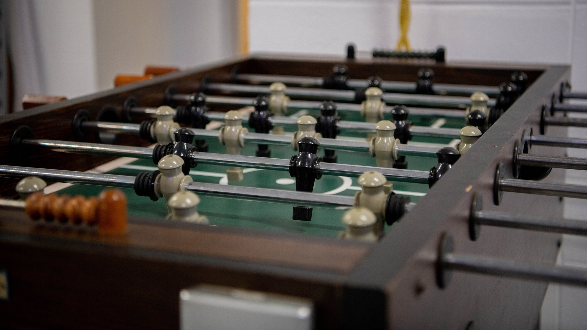 A foosball table sits in a room.