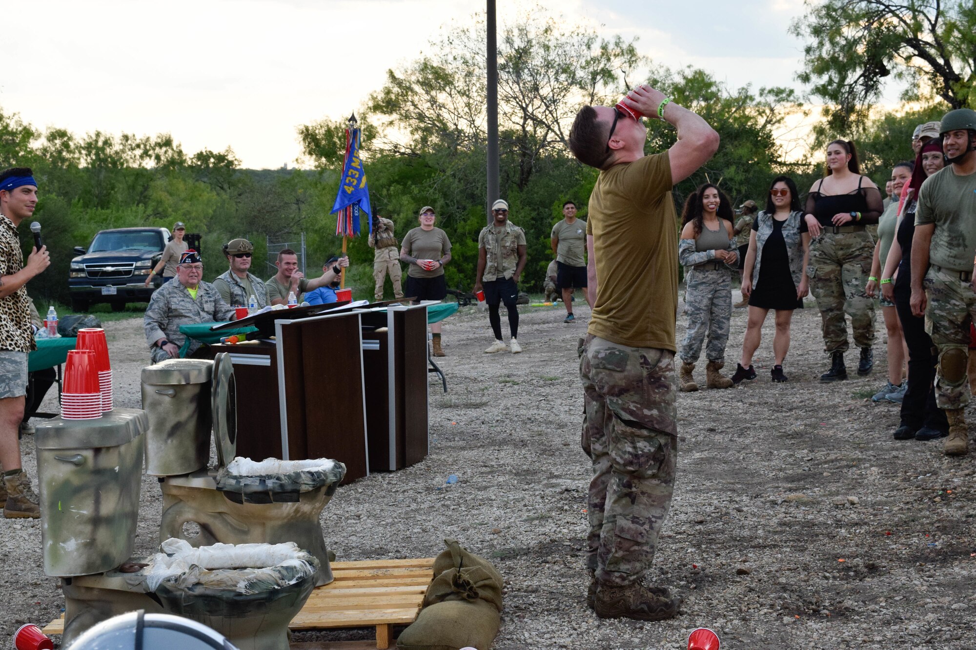 A 433rd Airlift Wing Airman drinks from the grog bowl during a combat dining-in event at Joint Base San Antonio-Chapman Training Annex, Texas, Sept. 10, 2022. According to U.S. Air Force tradition, rule violators have to drink from the grog bowl. (U.S. Air Force photo by Senior Airman Brittany Wich)