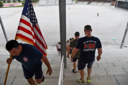 Members from the 433rd Civil Engineer Squadron participate in a 9/11 memorial stair climb at Joint Base San Antonio-Lackland, Texas, Sept. 11, 2022. The 433rd CES performs a stair climb every year to commemorate the 110 flights of stairs first responders had to climb inside the World Trade Center on Sept. 11, 2001. (U.S. Air Force photo by Staff Sgt. Adriana Barrientos)