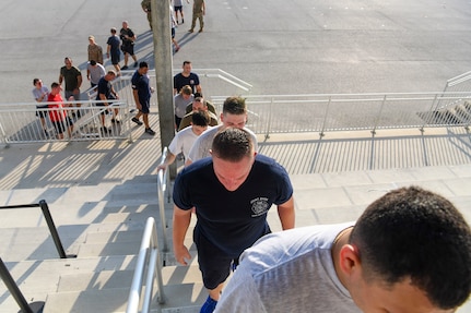 Members from the 433rd Civil Engineer Squadron participate in a 9/11 memorial stair climb at Joint Base San Antonio-Lackland, Texas, Sept. 11, 2022. The 433rd CES performs a stair climb every year to commemorate the 110 flights of stairs first responders had to climb inside the World Trade Center on Sept. 11, 2001. (U.S. Air Force photo by Staff Sgt. Adriana Barrientos)