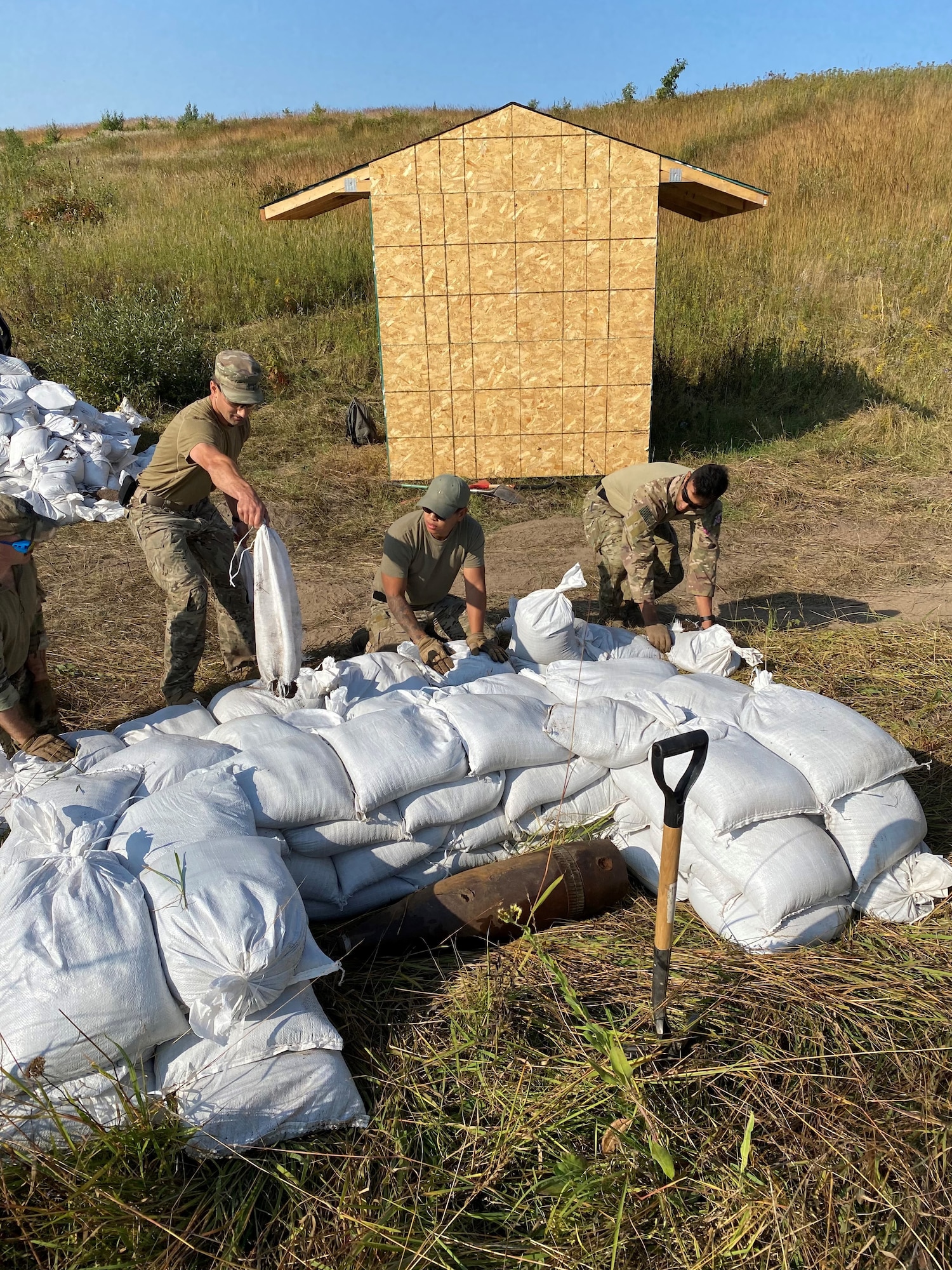 U.S. Air Force and Air National Guard Explosive Ordnance Disposal technicians use sandbag mitigation techniques to protect a nearby structure during the Advanced EOD Conventional Course held at Camp Ripley Training Center September 9-13, 2022.