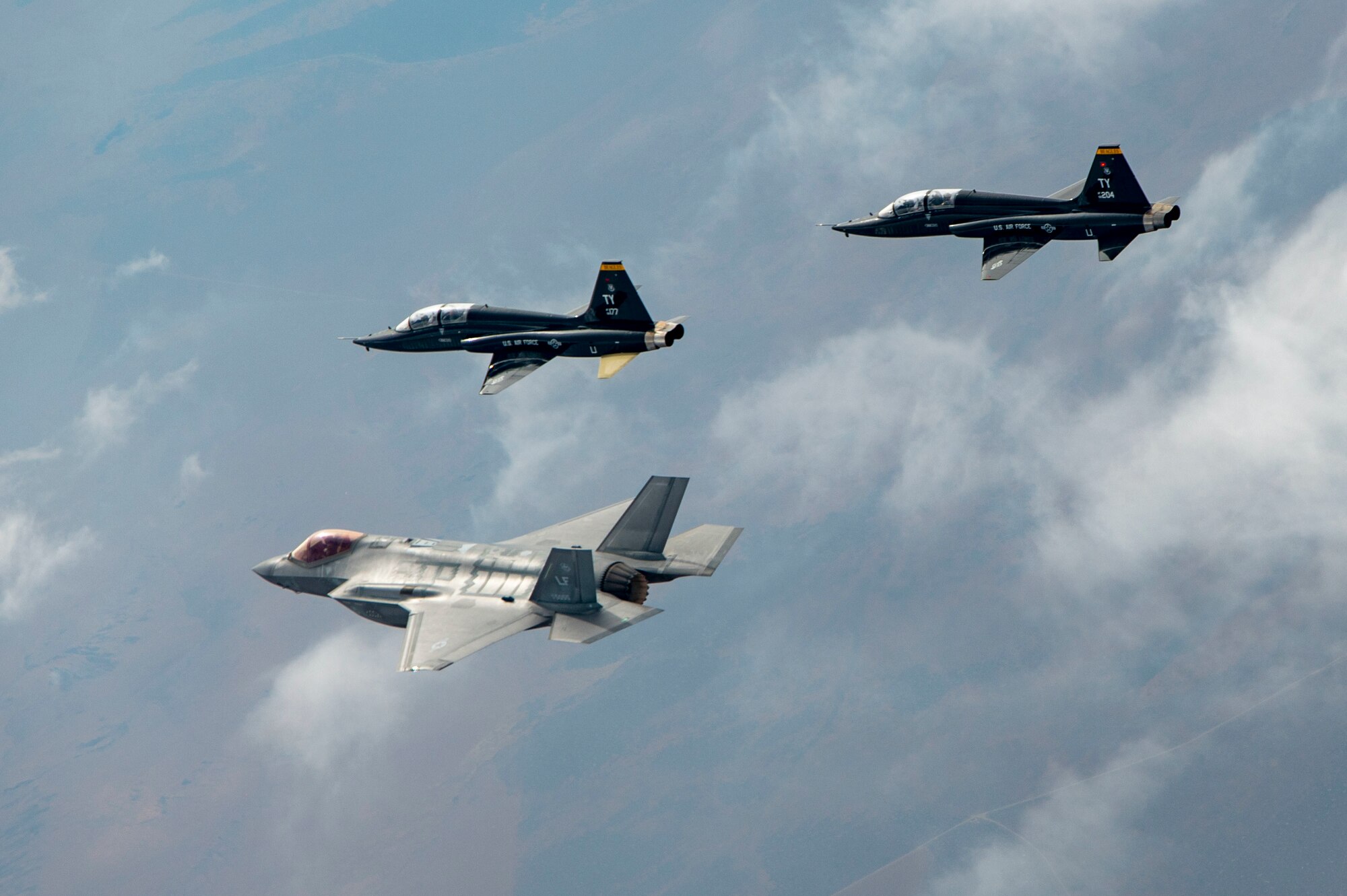 T-38 and F-35As fly in formation