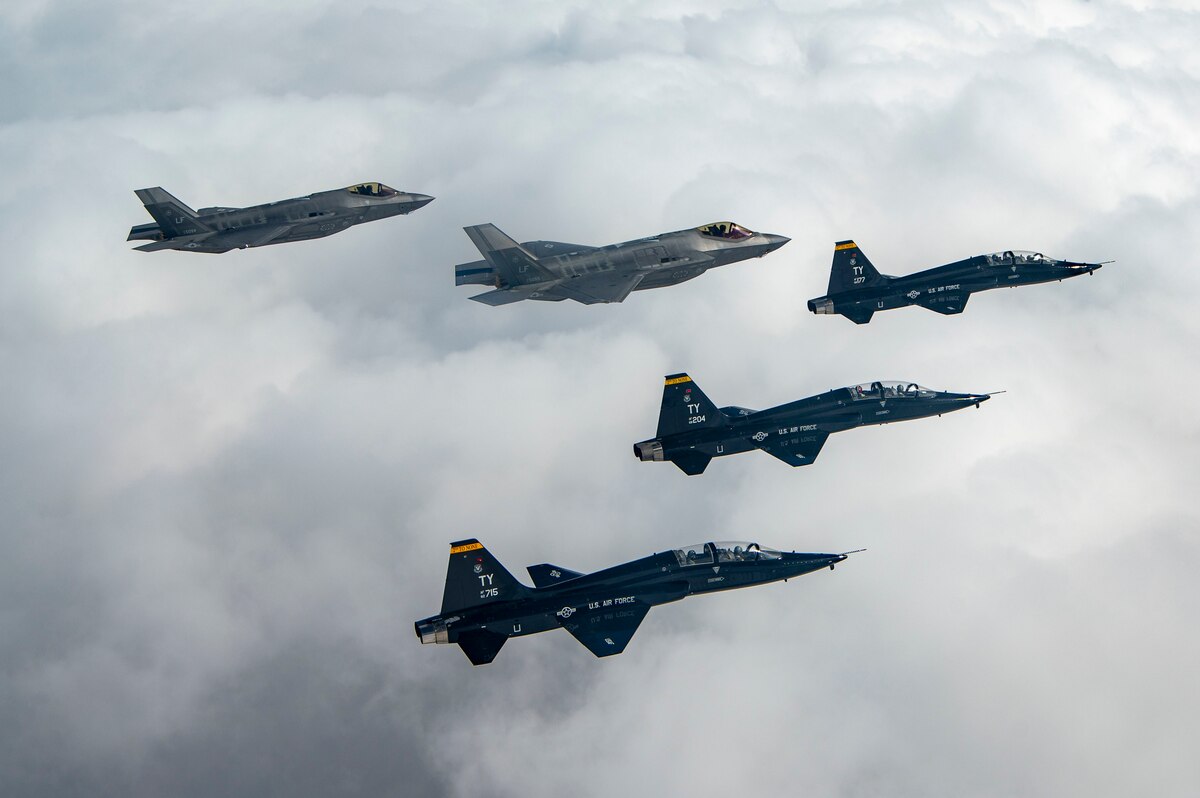 T-38s and F-35As fly in formation