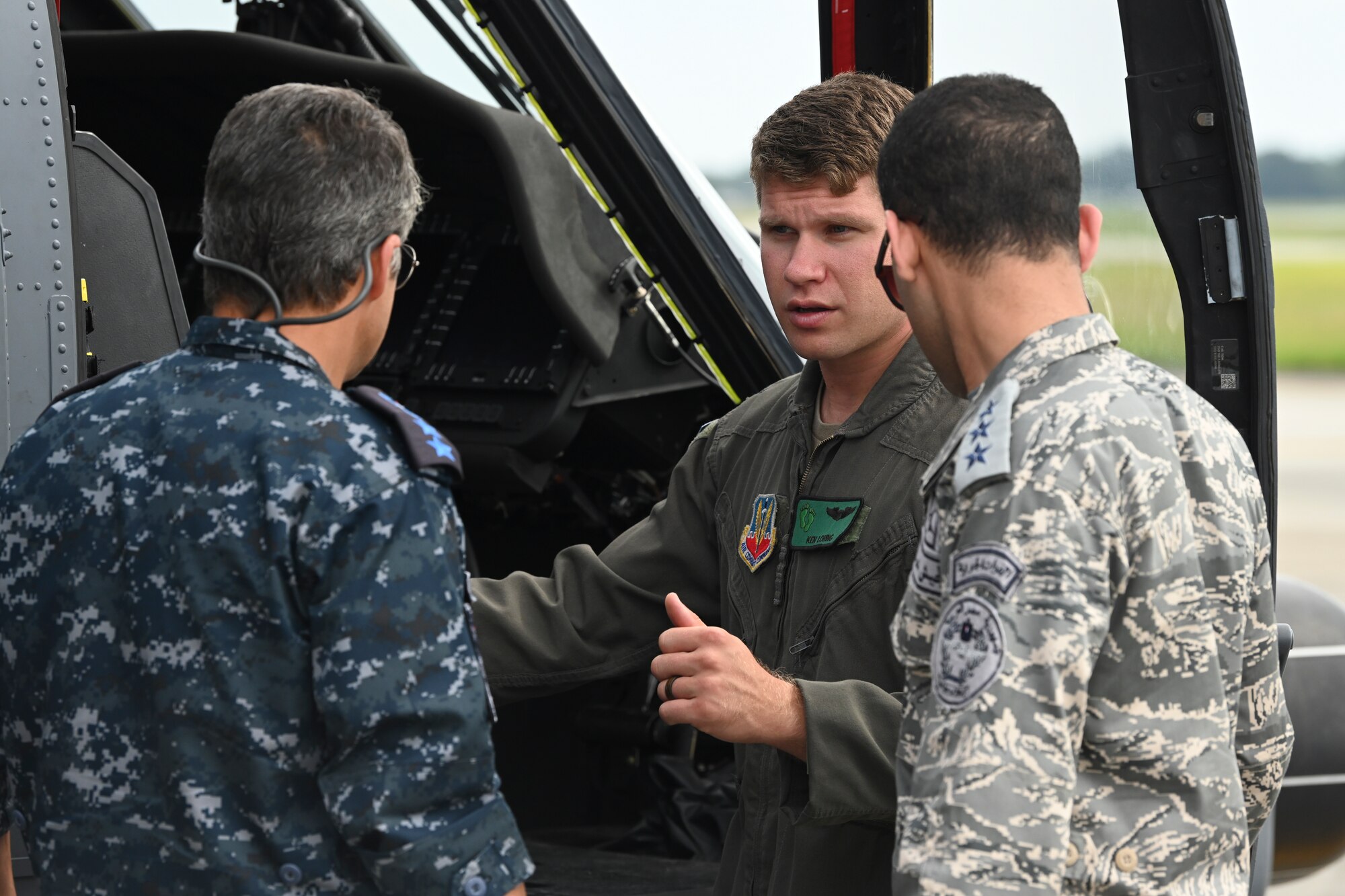 U.S. Air Force Capt. Kenneth Reyesloring, 41st Rescue Squadron HH-60W Jolly Green II pilot, converses with members of Egypt’s Air Force and Navy during a CSAR subject matter expert exchange at Moody Air Force Base, Georgia, Sept. 13, 2022. Egypt and the United States share a strategic security relationship, which plays a leading role in regional security and efforts to combat the spread of extremism. Engagements such as this ensure that the security relationship is not only forged at the strategic level but also the tactical and operational levels, creating a cohesive, layered approach to creating a safe and stable theater. (U.S. Air Force photo by Airman 1st Class Rachel Coates)
