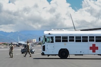 Personnel with the 15th Medical Group provide medical care for an infected patient with an En Route Patient Staging System during an aircraft swap at Joint Base Pearl Harbor-Hickam, Hawaii, Sept. 21, 2022. The patient, housed in a Negative Pressure Conex-Lite, was cared for by 15th MDG personnel while waiting for the NPCL to be placed on a Hickam C-17 Globemaster III. (U.S. Air Force photo by Staff Sgt. Alan Ricker)