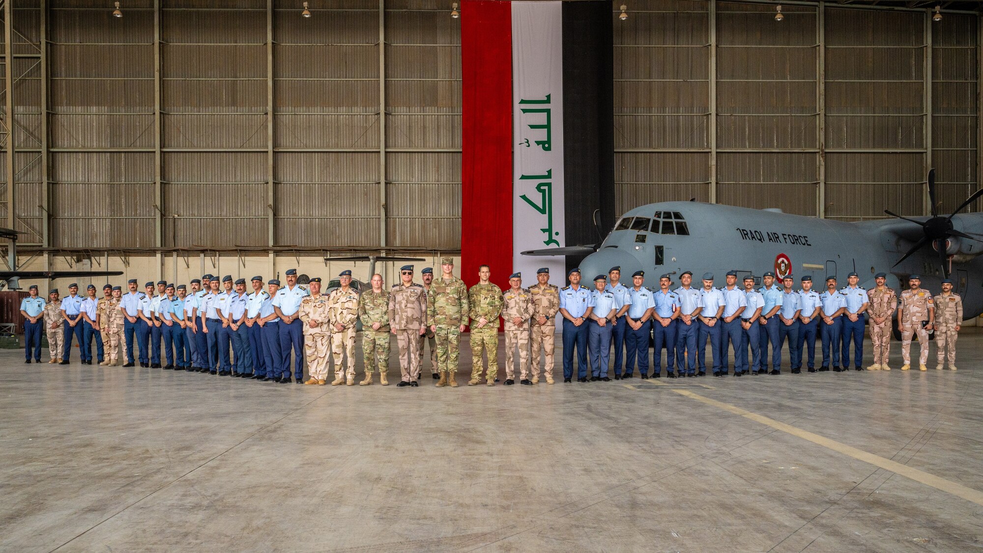 Lt. Gen. Alexus G. Grynkewich, Ninth Air Force (Air Forces Central) commander poses for a group photo with Iraqi embassy members, Iraqi Air Force members and leadership in Baghdad, Iraq, Sep. 6, 2022. During his visit, Grynkewich met with Iraqi military and embassy leaders to better integrate military operations, strengthen resolute partnerships and ensure security within the U.S. Central Command area of responsibility (US. Air Force photo by Senior Airman Dominic Tyler)