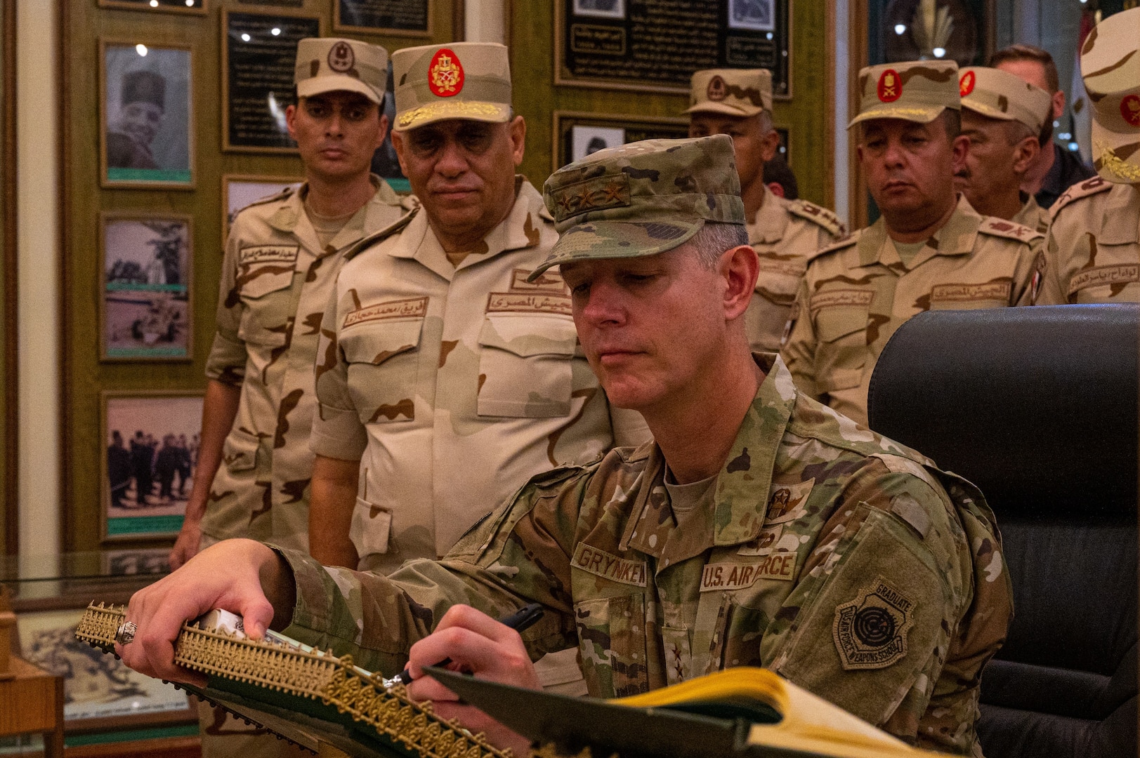 U.S. Air Force Lt. Gen. Alexus G. Grynkewich, Ninth Air Force (Air Forces Central) commander, signs a distinguished visitor’s log at the Egyptian Air Defense Force museum in Cairo, Egypt, Aug. 30, 2022. During his visit, Grynkewich met with Egyptian military leaders to better integrate military operations, strengthen resolute partnerships and ensure security within the U.S. Central Command area of responsibility. (U.S. Air Force photo by Senior Airman Dominic Tyler)
