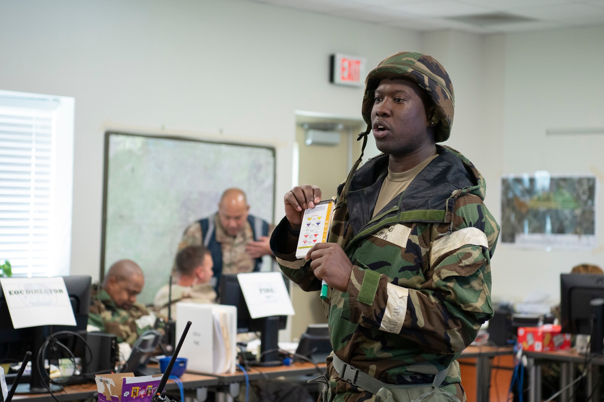 Tech. Sgt. Nathan Davis, the Emergency Operations Center manager assigned to the 94th Civil Engineering Squadron, goes over hazard marking procedures during an exercise at Dobbins Air Reserve Base, Ga. Sept. 23, 2022. Dobbins ARB hosted, coordinated, and participated in a base-wide exercise, called United Forces 22-01, from Sept. 19-25 to test readiness capabilities. (U.S. Air Force photo by Senior Airman Kendra A. Ransum)