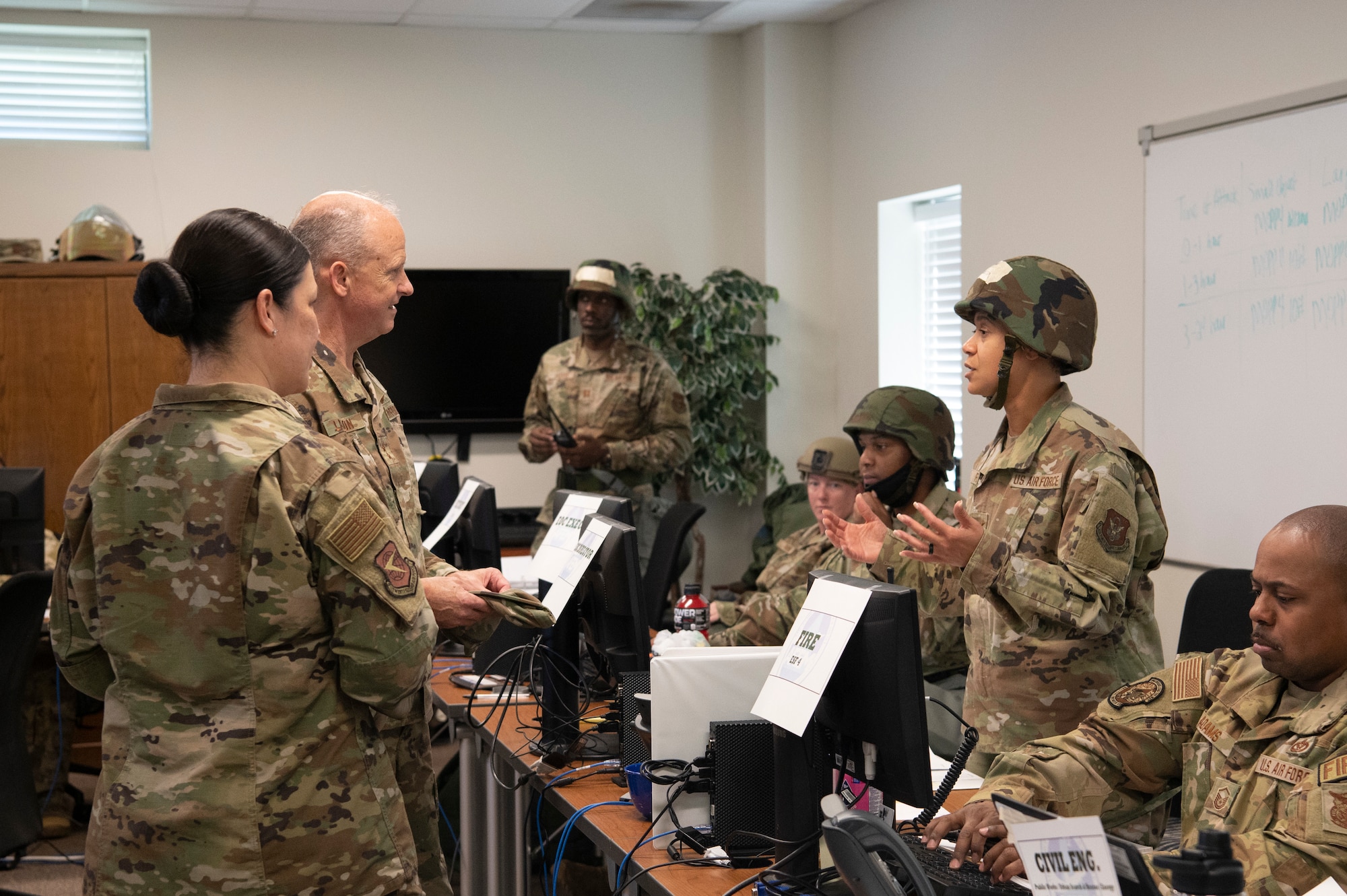 Col. Dion R. Flynn (right), Commander of the 94th Missions Support Group, briefs Maj. Gen. Bret C. Larson, Commander of the 22nd Air Force, and Chief Master Sgt. Chin M. Cox, Command Chief Master Sergeant of the 22nd Air Force, at Dobbins Air Reserve Base, Ga. Sept. 23, 2022. Dobbins ARB hosted, coordinated, and participated in a base-wide exercise, called United Forces 22-01, from Sept. 19-25 to test readiness capabilities. (U.S. Air Force photo by Senior Airman Kendra A. Ransum)