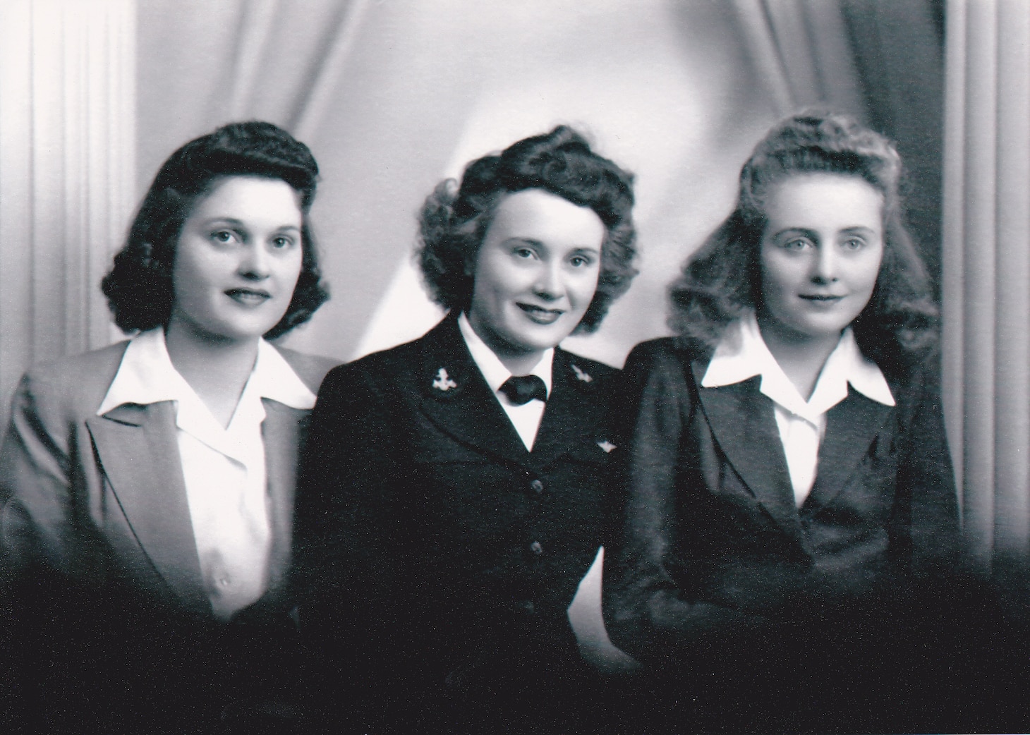 An undated portrait of Alice Starnes (center) with her sisters Nadia and Kathryn during World War II.