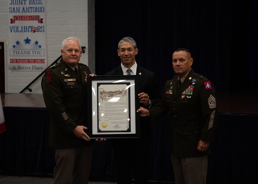 (From left to right) U.S. Army Lt. Gen. John Evans, U.S. Army North’s commanding general, San Antonio Mayor Ron Nirenberg and Command Sgt. Maj. Phil Barretto, U.S. Army North’s senior enlisted advisor, presented a proclamation declaring September 25, 2022, as Gold Star Mother’s and Family Day, during a ceremony held at Joint Base San Antonio-Fort Sam Houston, Texas. Gold Star Mother’s and Family Day honors the mothers, fathers, and families of fallen military service members. It provides an opportunity for us as a nation to pay tribute to their sacrifices and support those who remain behind. (U.S. Army Photo by Spc. Gianna Elle Sulger)