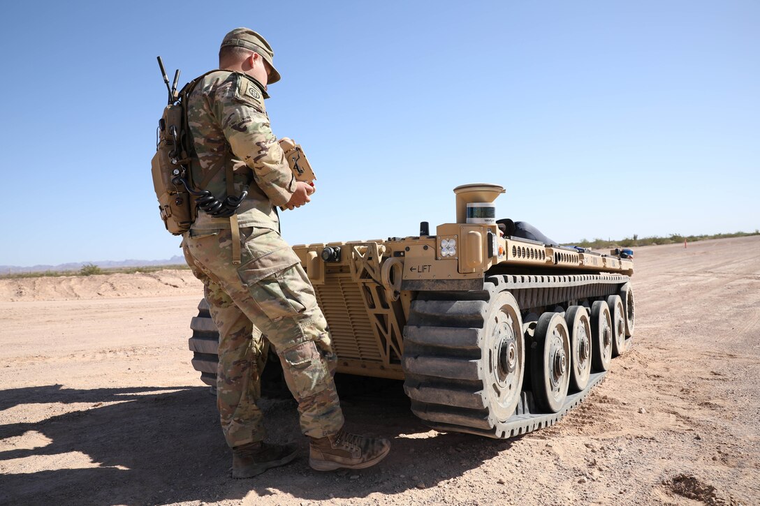 U.S. Army Pfc. Daniel Candales, assigned to the 82nd Airborne Division, uses the tactical robotic controller to control the expeditionary modular autonomous vehicle as a practice exercise in preparation for Project Convergence at Yuma Proving Ground, Ariz., October 19, 2021. During Project Convergence 21, Soldiers are experimenting with using the vehicle for semi-autonomous reconnaissance and re-supply. 



Project Convergence is the Army's campaign of learning designed to aggressively advance and integrate our Army's contributions, based on a continuous structured series of demonstrations and experiments throughout the year. It ensures that the Army is part of the joint fight and can rapidly and continuously integrate or converge effects across all domains: air, land, sea, space, and cyberspace; to overmatch our adversaries in competition and conflict.



Project Convergence ensures the Army has the right people with the right systems, properly enabled in the right places to support the joint fight.

 (U.S. Army photo by Sgt. Marita Schwab)