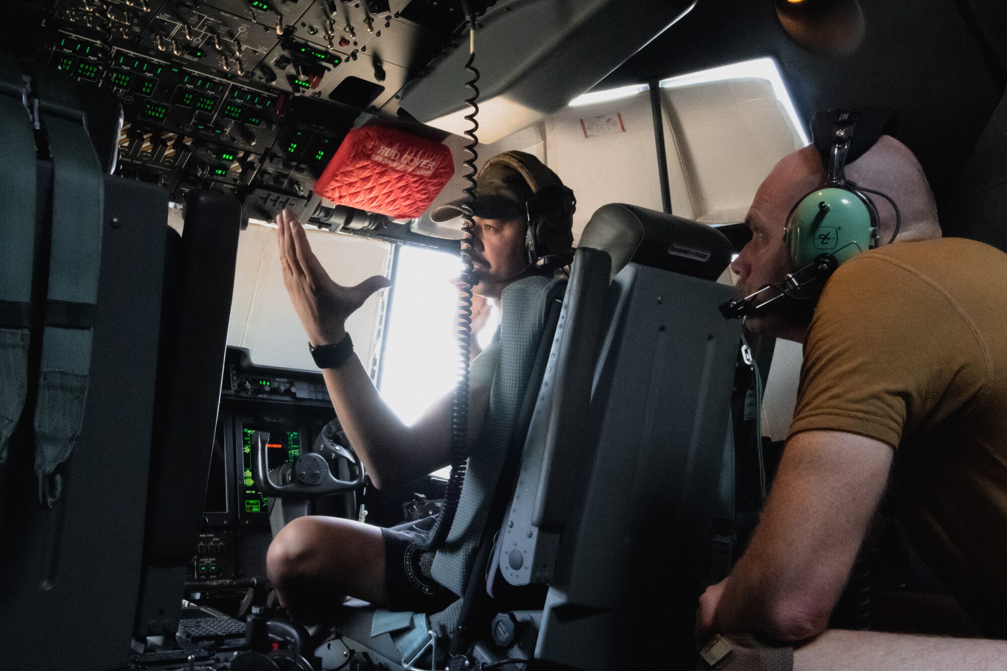 U.S. Air Force Tech. Sgt. Michael Sanchez, Crew Chief, 801st Expeditionary Maintenance Squadron, describes parts and functions of a C-130J Super Hercules aircraft to 332d Air Expeditionary Wing Commander Col. Jason Houston, as part of the “Red Tail Connection” program at an undisclosed location in Southwest Asia, September 21, 2022. These immersion visits provide greater insight into the unique skillsets every Airman brings to the 332d AEW Red Tail team. (U.S. Air Force photo by Tech. Sgt. Richard Mekkri)