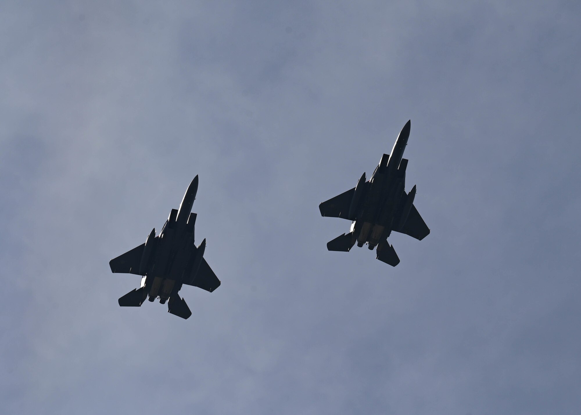Two Republic of Korea Air Force F-15K Slam Eagles assigned to the 110th Fighter Squadron fly above Kunsan Air Base, Republic of Korea, Sept. 22, 2022. The F-15K Slam Eagle is a mutli-role fighter aircraft in service with ROKAF since 2005. (U.S. Air Force photo by Staff Sgt. Isaiah J. Soliz)