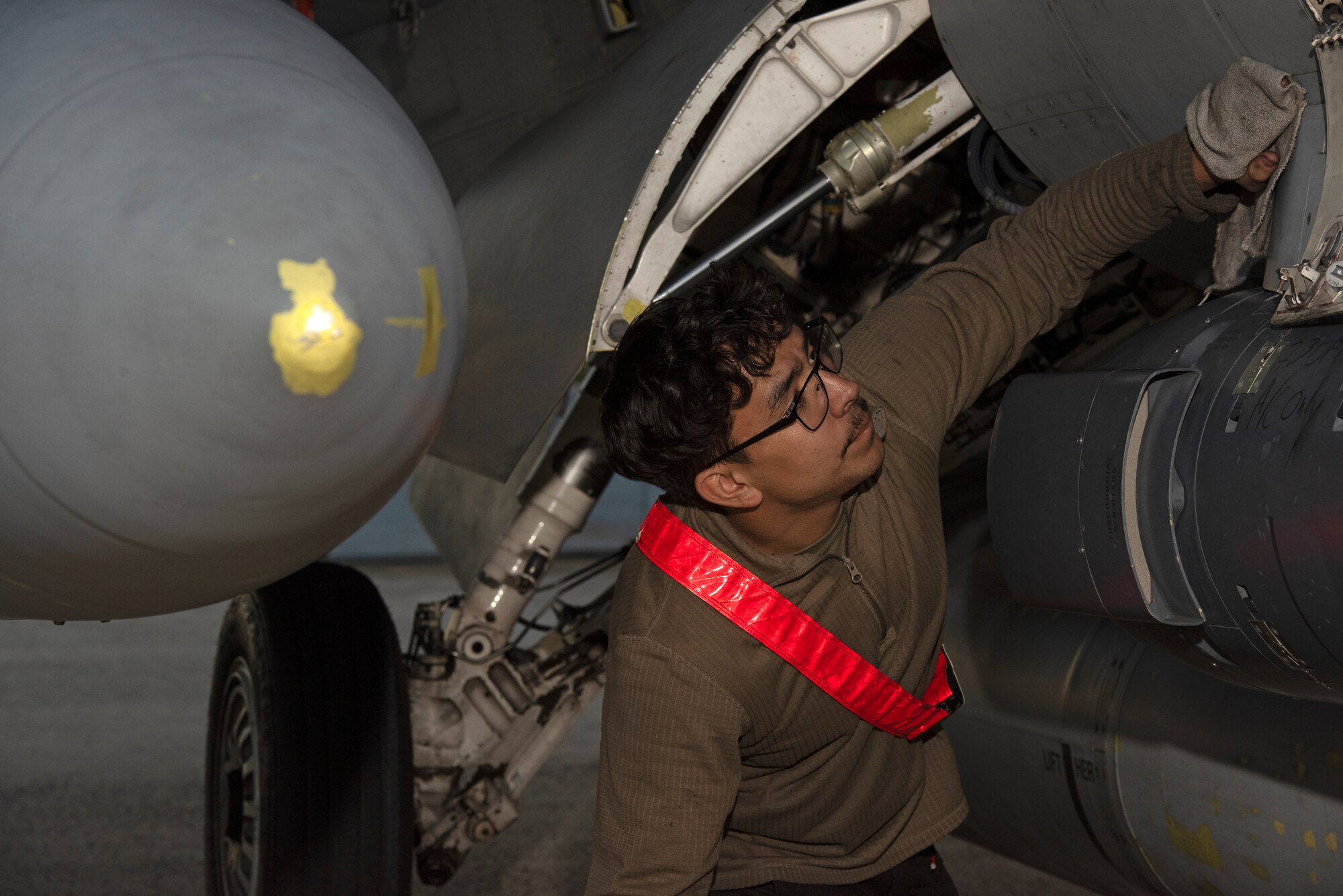 An Airman inspects an aircraft.