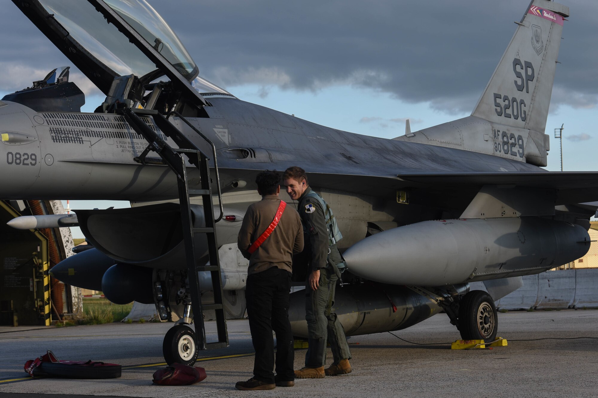 An Airman talks to a pilot.