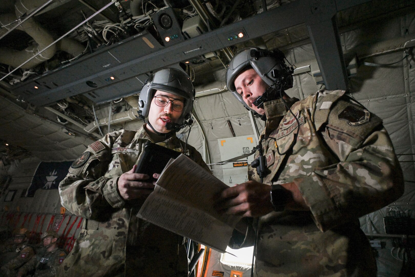 Tech. Sgt. Ryan Fenimore and Senior Airman Alex Huff, load masters, 181st Operations Squadron, Texas Air National Guard,  prepare the aircraft before takeoff during the Falcon Leap Exercise in Eindhoven, Netherlands, Sept. 13, 2022. Falcon Leap is part of the remembrance ceremonies for the anniversary of the World War II Operation Market Garden and is NATO’s largest technical airborne exercise.