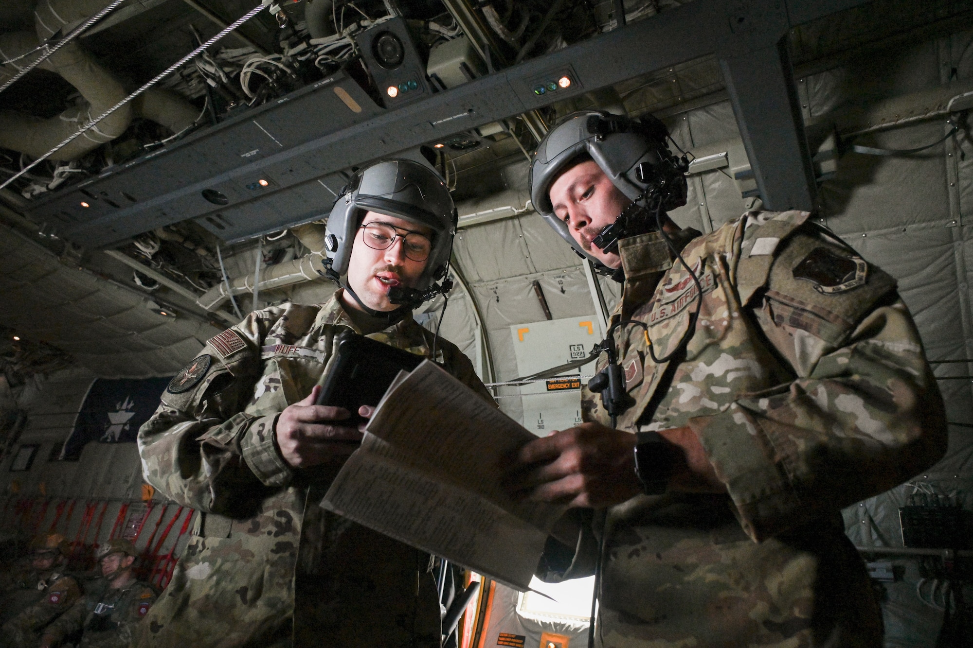 Tech. Sgt. Ryan Fenimore and Senior Airman Alex Huff, load masters, 181st Operations Squadron, Texas Air National Guard,  prepare the aircraft before takeoff during the Falcon Leap Exercise in Eindhoven, Netherlands, Sept. 13, 2022. Falcon Leap is part of the remembrance ceremonies for the anniversary of the World War II Operation Market Garden and is NATO’s largest technical airborne exercise.