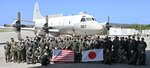 KADENA AIR BASE, Japan (Sept. 21, 2022) – Members of Japan Maritime Self-Defense Force Air Reconnaissance Squadron (VQ) 81 and Fleet Air Reconnaissance Squadron (VQ) 1 pose for a group photo in front of a US Navy EP-3 during Raijin 22-2, an annual unit exchange. Based out of Whidbey Island, Washington, the VQ-1 “World Watchers” are currently operating from Kadena Air Base in Okinawa, Japan. The squadron conducts naval operations as part of a rotational deployment to the U.S. 7th Fleet area of operations. (U.S. Navy photo by Mass Communication Specialist First Class Glenn Slaughter)