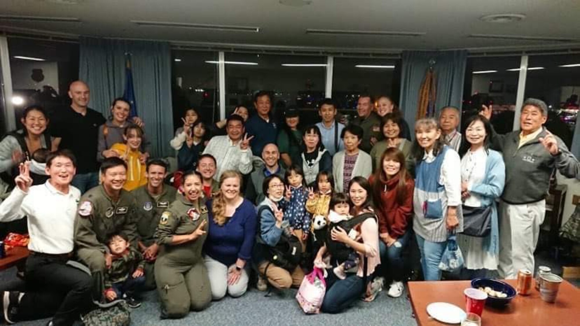 U.S. Air Force Lt. Col. John Wright, 4th Reconnaissance Squadron commander, and other members of the Musashi-Murayama friendship club pose for a photo at Yokota Air base, Japan. While deployed to Yokota Air Base, Japan, 4th RS airmen connect with the local community through personal interest, building relationships between the base and the Japanese community. (Courtesy Photo)