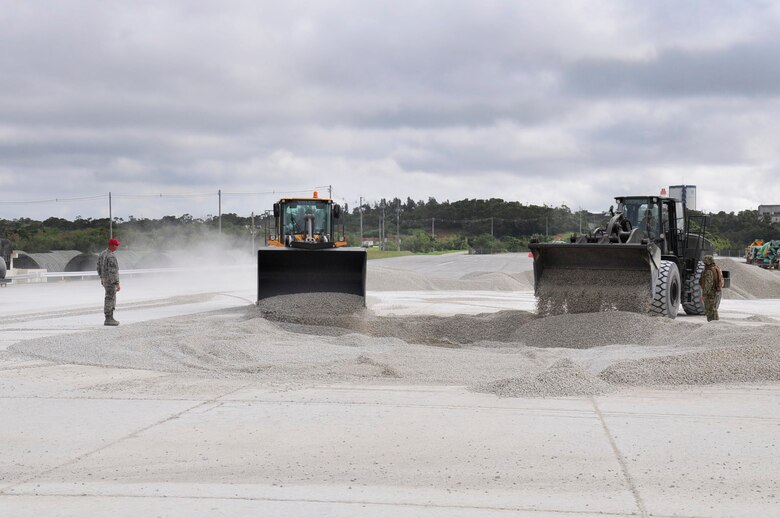 Seabees assigned to Naval Mobile Construction Battalion 40 attend a U.S. Air Force school for airfield damage repair at the Red Horse Engineering facility on Kadeena Air Base. Air Force engineers specialize in airfield repairs, water and fuel units and engineering surveying.