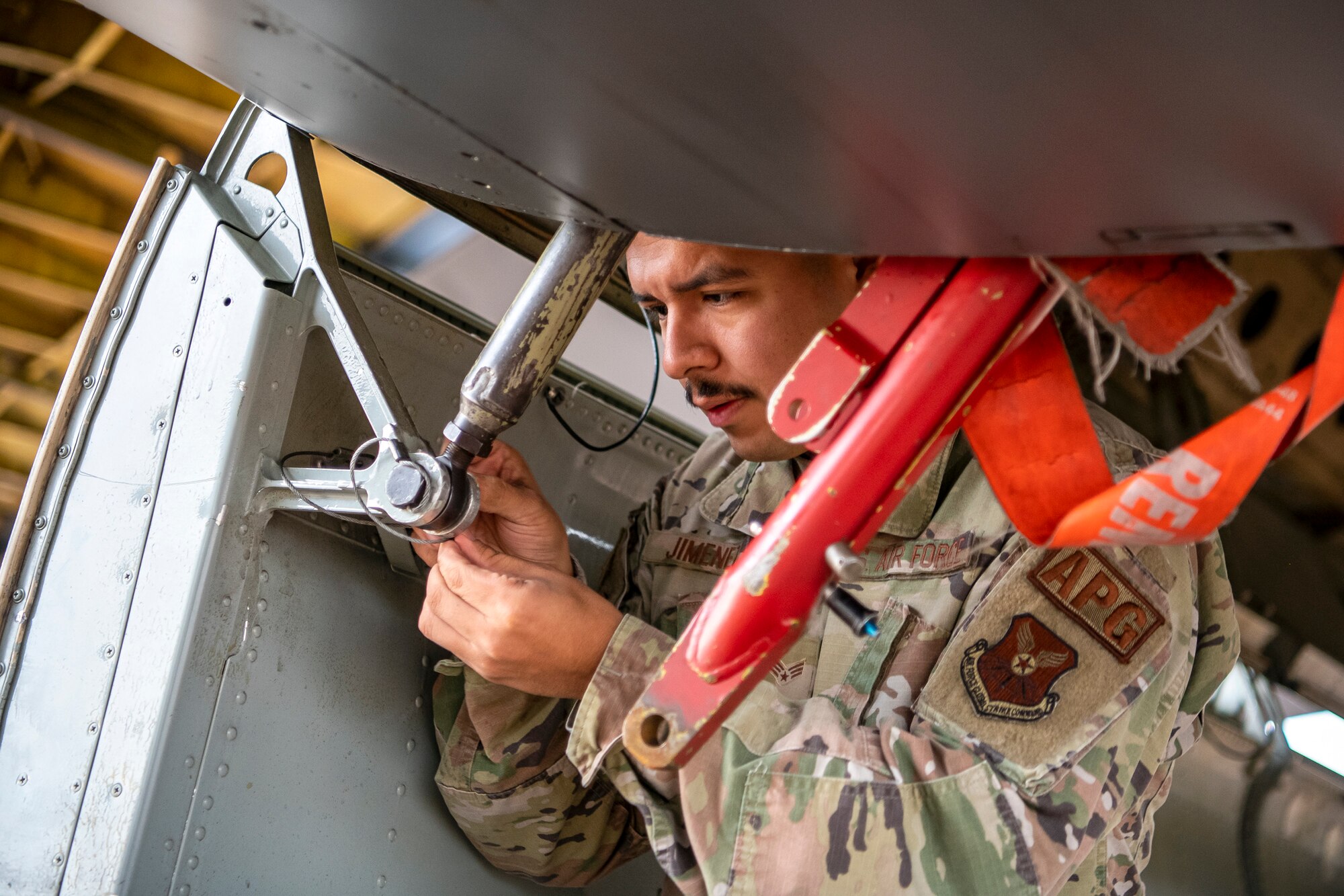 U.S. Air Force Senior Airman Erik Jimenez, 23rd Aircraft Maintenance unit apprentice, adjusts a component on a B-52 Stratofortress aircraft assigned to the 23rd Expeditionary Bomb Squadron prior to departure at RAF Fairford, United Kingdom, Sept. 21, 2022. Jimenez was part of a Bomber Task Force focused on deterring adversaries, assuring allies and partners, strengthening interoperability and maintaining and demonstrating readiness and lethality across Europe. (U.S. Air Force photo by Staff Sgt. Eugene Oliver)