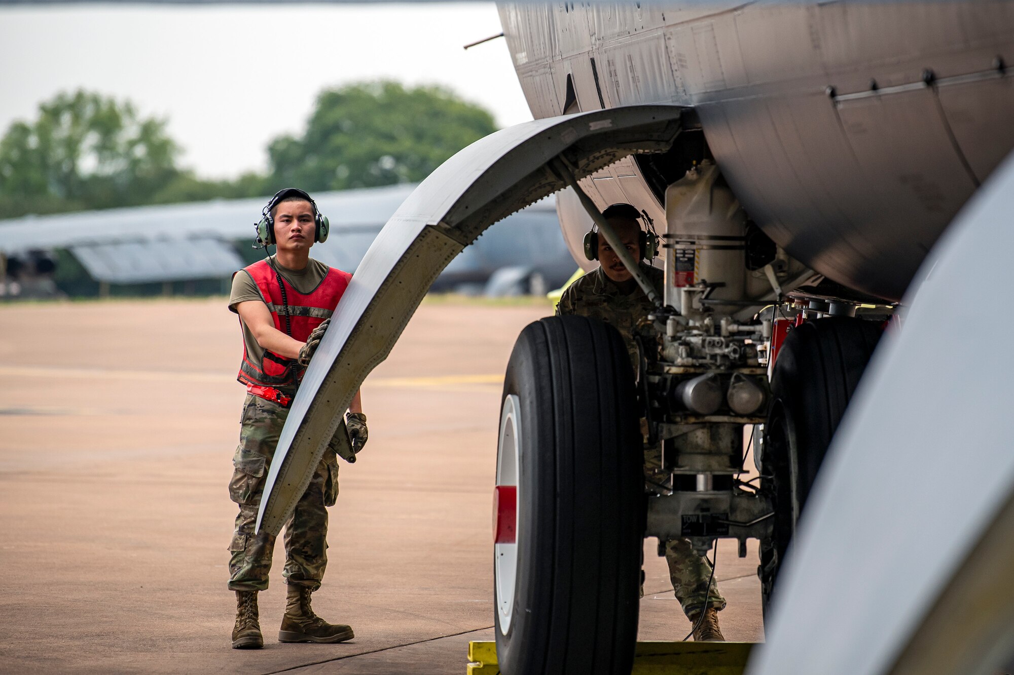 Airmen from the 23rd Aircraft Maintenance Unit, inspect the landing gear of a B-52 Stratofortress aircraft assigned to the 23rd Expeditionary Bomb Squadron at RAF Fairford, United Kingdom, Sept. 21, 2022. Dozens of Airmen supported the Bomber Task Force missions which was intended to deter adversaries, assure allies and partners, strengthen interoperability, maintain and demonstrate readiness and lethality. (U.S. Air Force photo by Staff Sgt. Eugene Oliver)