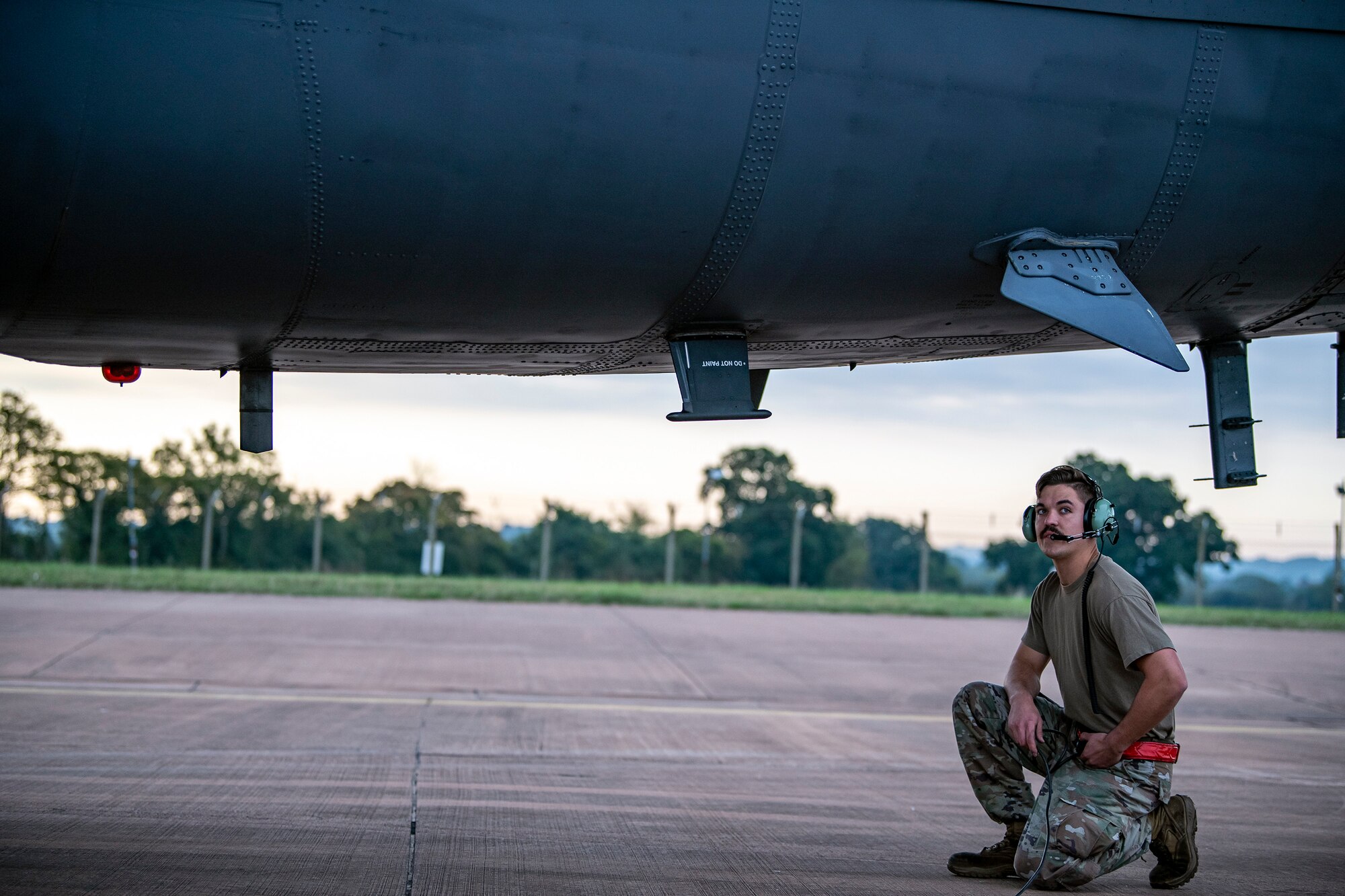 An Airman from the 23rd Aircraft Maintenance Unit, inspects the underbelly of a B-52 Stratofortress aircraft assigned to the 23rd Expeditionary Bomb Squadron at RAF Fairford, United Kingdom, Sept. 21, 2022 Dozens of Airmen supported the Bomber Task Force mission which was intended to deter adversaries, assure allies and partners, strengthen interoperability, maintain and demonstrate readiness and lethality. (U.S. Air Force photo by Staff Sgt. Eugene Oliver)