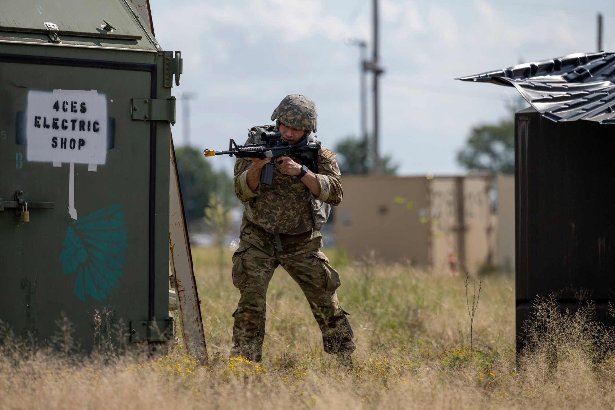 Senior Airman Daniel Tumminello, 4th Operations Support Squadron air traffic control specialist, participates in a shoot, move and communicate training during a Multi-Capable Airman exercise at Seymour Johnson Air Force Base, North Carolina, Sept. 20, 2022. SMC training focuses on situational awareness, performing under pressure and team communication. (U.S. Air Force photo by Senior Airman Kevin Holloway)