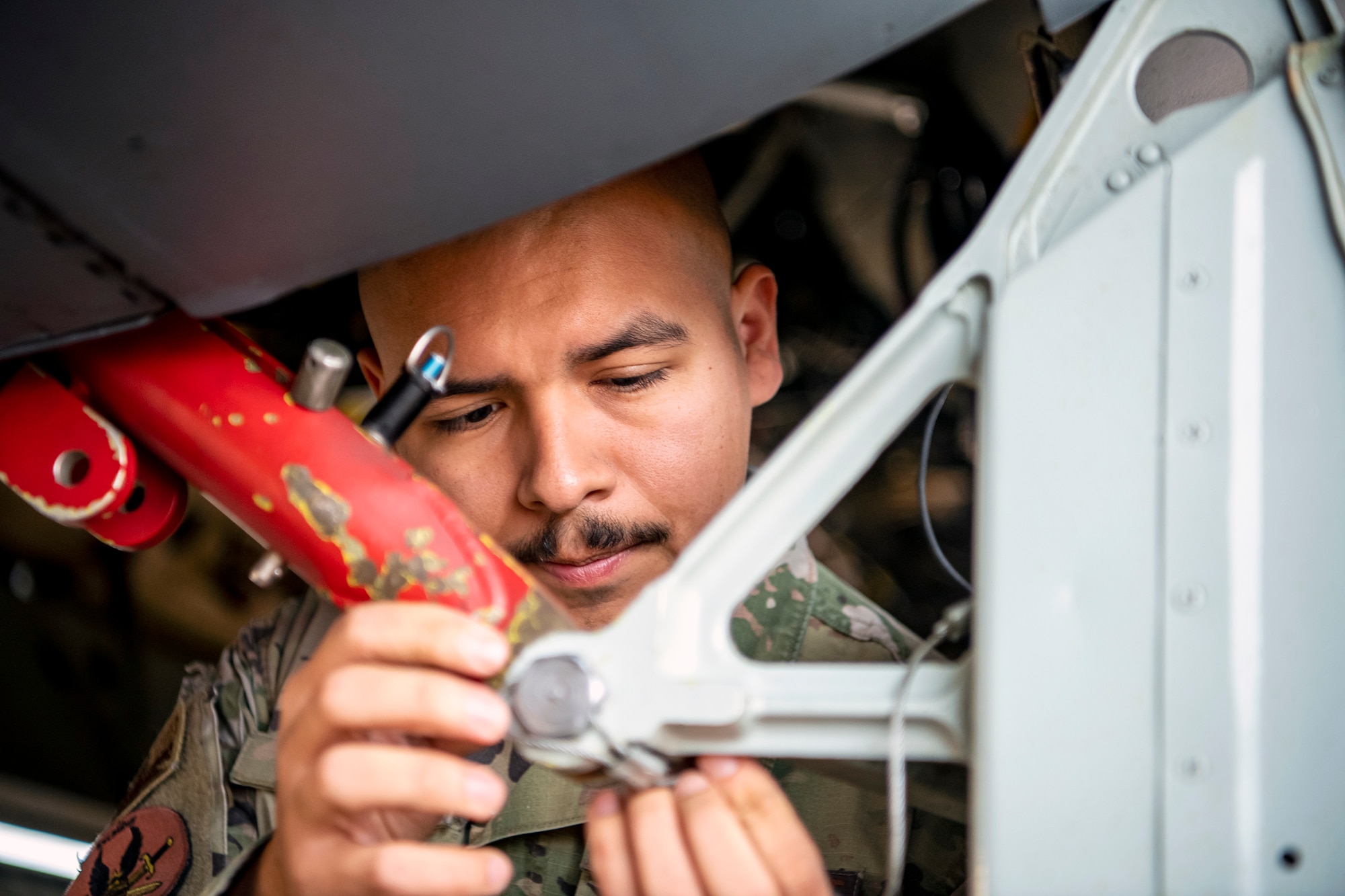 U.S. Air Force Senior Airman Erik Jimenez, 23rd Aircraft Maintenance unit apprentice, adjusts a component on a B-52 Stratofortress aircraft assigned to the 23rd Expeditionary Bomb Squadron, prior to departure at RAF Fairford, United Kingdom, Sept. 21, 2022. Jimenez was part of a Bomber Task Force focused on deterring adversaries, assuring allies and partners, strengthening interoperability, and maintaining and demonstrating readiness and lethality across Europe. (U.S. Air Force photo by Staff Sgt. Eugene Oliver)