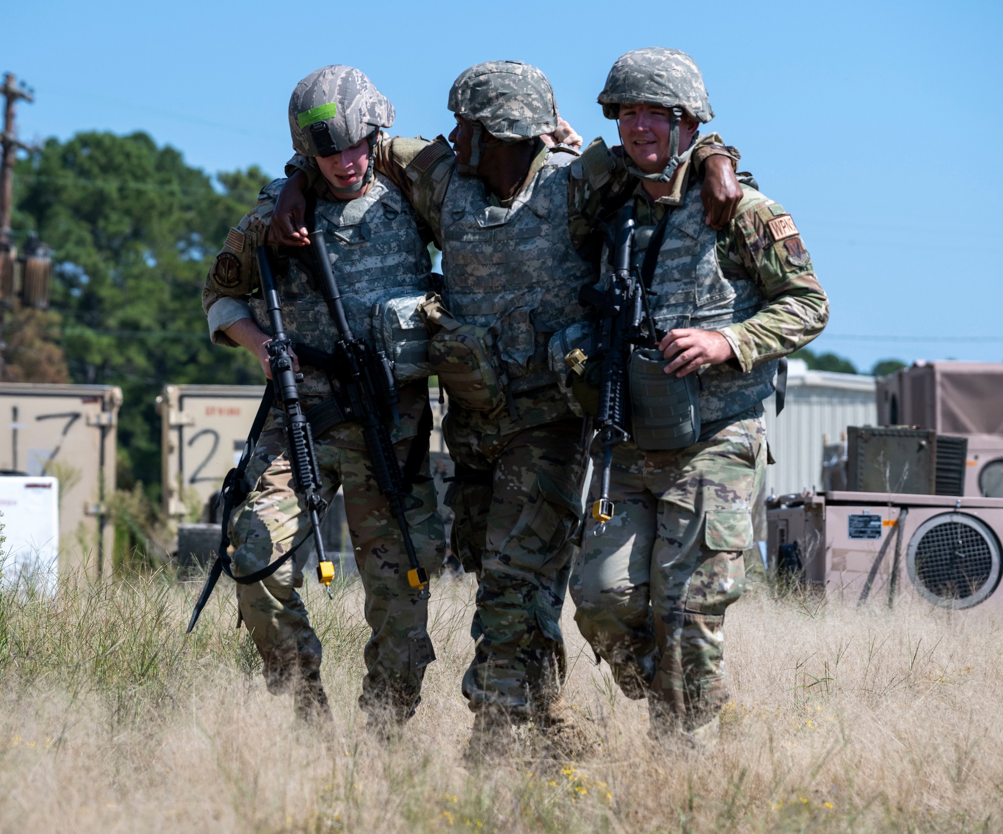 Airmen assigned to the 4th Fighter Wing participate in a Multi-Capable Airman field training exercise at Seymour Johnson Air Force Base, North Carolina, Sept. 20, 2022. During the exercise, Airmen used the skills they learned throughout the 10-day MCA training to set up a simulated forward operating base, build a command center, post security at designated defensive fighting positions, defend against a simulated attack, and care for the simulated casualties during the attack. (U.S. Air Force photo by Senior Airman Kevin Holloway)