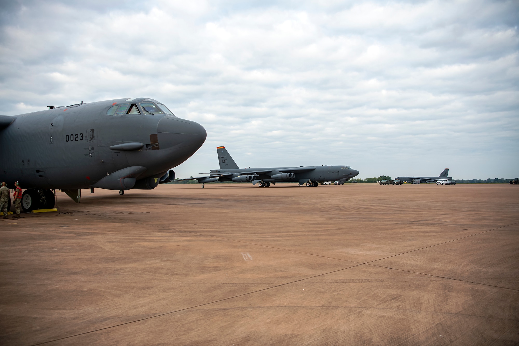 B-52 Stratofortress aircraft assigned to the 23rd Expeditionary Bomb Squadron que on the flightline prior to takeoff at RAF Fairford, United Kingdom, Sept. 21, 2022. The aircraft were part of a Bomber Task Force which is the global employment of U.S. strategic bombers, that provide strategic military advantage to achieve national and combatant commander objectives. (U.S. Air Force photo by Staff Sgt. Eugene Oliver)