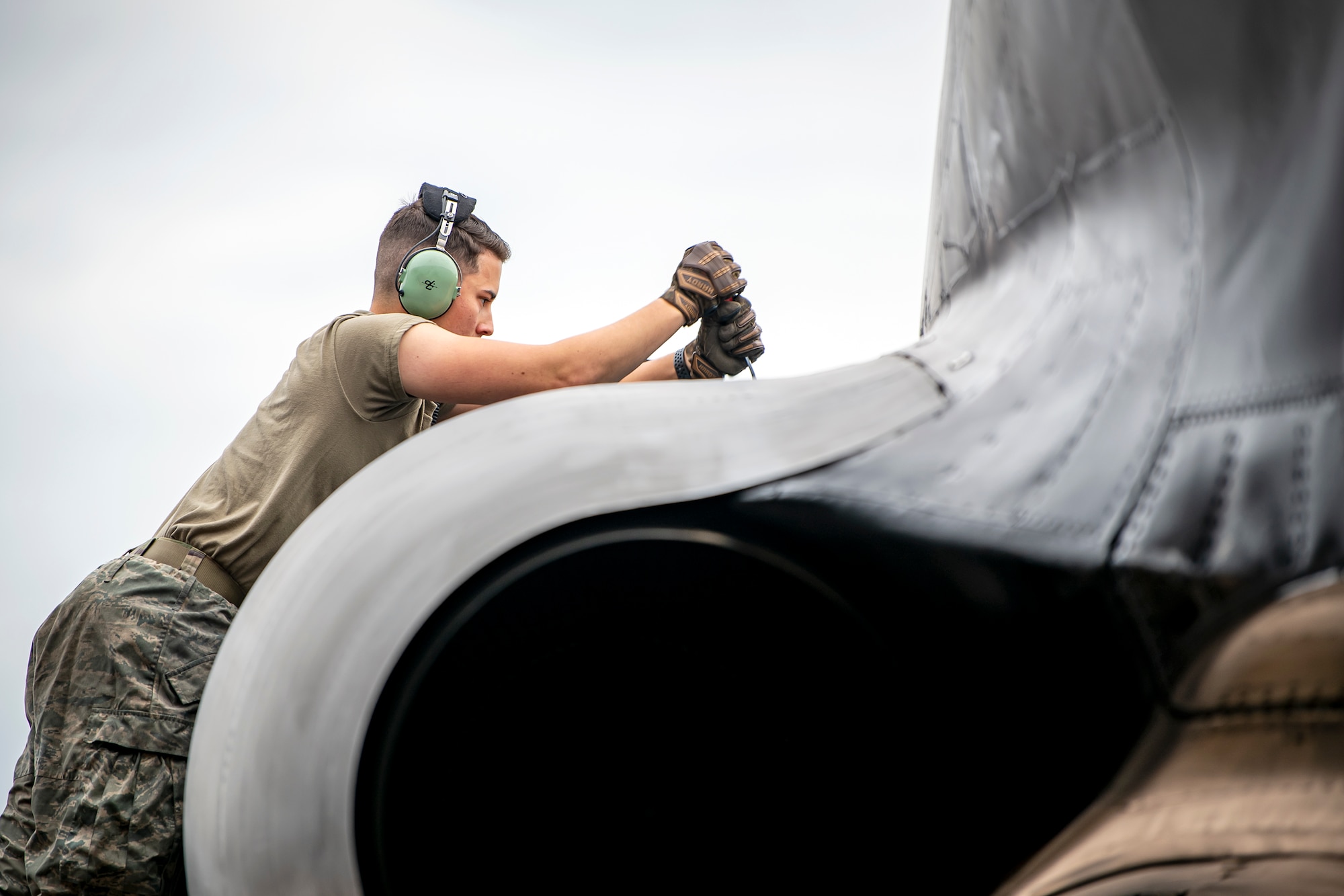 An Airman from the 23rd Aircraft Maintenance Unit, performs maintenance on the engine of a B-52 Stratofortress aircraft assigned to the 23rd Expeditionary Bomb Squadron at RAF Fairford, United Kingdom, Sept. 21, 2022. Dozens of Airmen supported the Bomber Task Force mission which was intended to deter adversaries, assure allies and partners, strengthen interoperability, maintain and demonstrate readiness and lethality. (U.S. Air Force photo by Staff Sgt. Eugene Oliver)