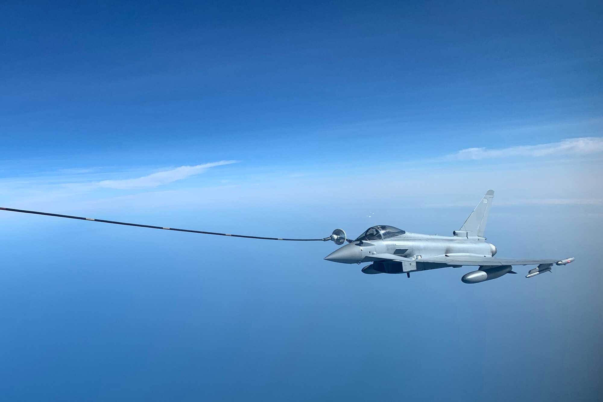 A Royal Air Force Eurofighter Typhoon aircraft receives fuel over the North Sea from a U.S. Air Force KC-135 Stratotanker aircraft assigned to the 100th Air Refueling Wing during exercise Cobra Warrior 22, Sept. 21, 2022. Cobra Warrior develops the tactical interoperability skills of participating U.S. Airmen, allies and partners within a composite air operation environment. (U.S. Air Force photo by Tech. Sgt. Anthony Hetlage)