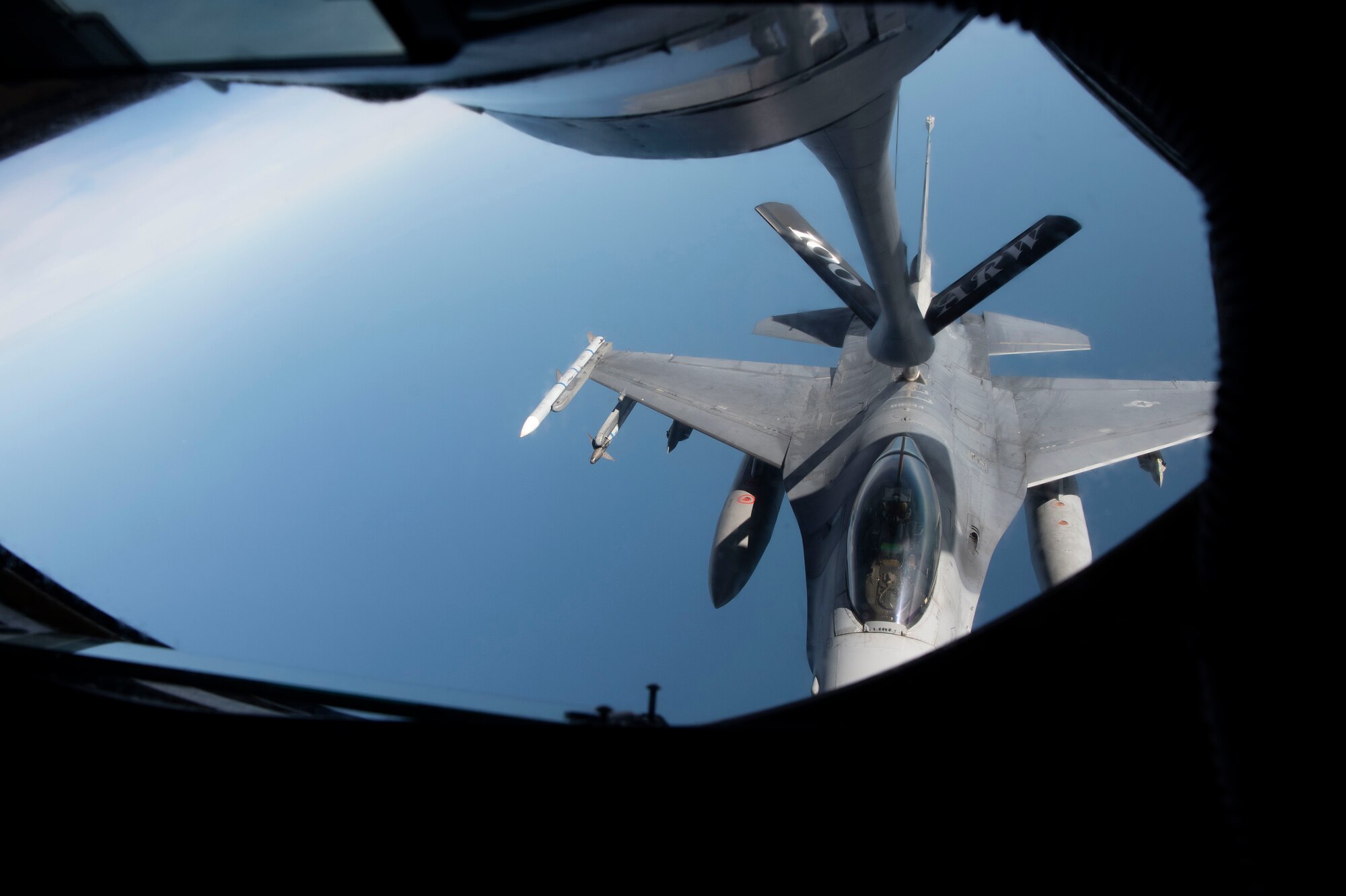 A U.S. Air Force F-16C Fighting Falcon aircraft assigned to the 31st Fighter Wing, Aviano Air Base, Italy, receives fuel over the North Sea from a KC-135 Stratotanker aircraft assigned to the 100th Air Refueling Wing during exercise Cobra Warrior 22, Sept. 21, 2022. The United States’ commitment to defending NATO territory is ironclad and the U.S. will continue to bolster its posture to better defend partners and allies. (U.S. Air Force photo by Tech. Sgt. Anthony Hetlage)