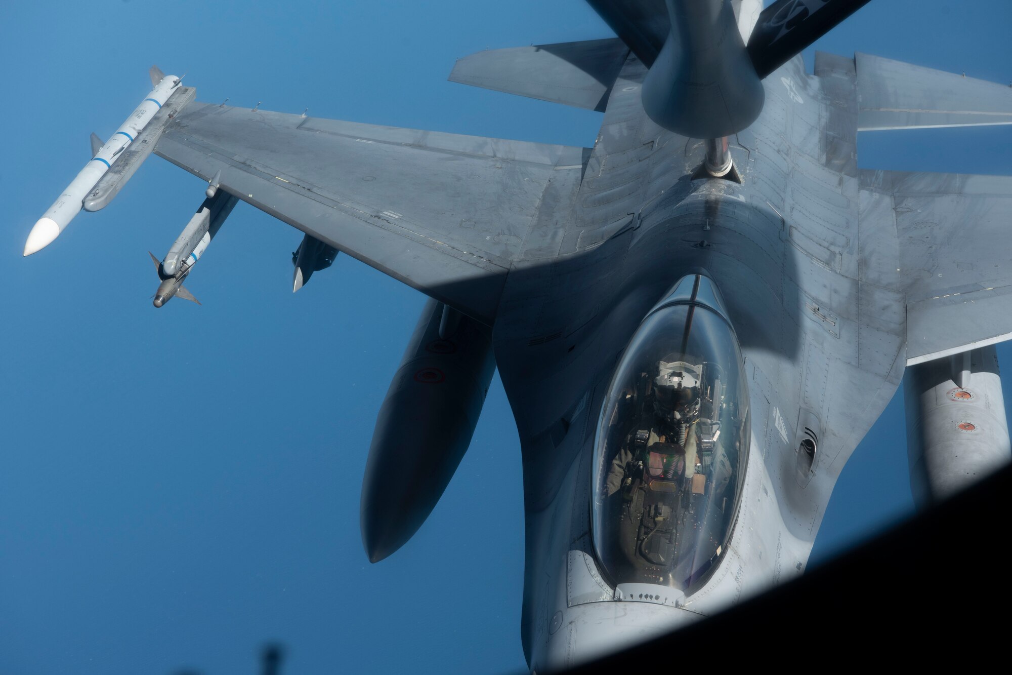A U.S. Air Force F-16C Fighting Falcon aircraft assigned to the 31st Fighter Wing receives fuel over the North Sea from a KC-135 Stratotanker aircraft assigned to the 100th Air Refueling Wing, during exercise Cobra Warrior 22, Sept. 21, 2022. The exercise provides valuable opportunities for all participating forces to practice and develop tactics, techniques and procedures in complex scenarios. (U.S. Air Force photo by Tech. Sgt. Anthony Hetlage)