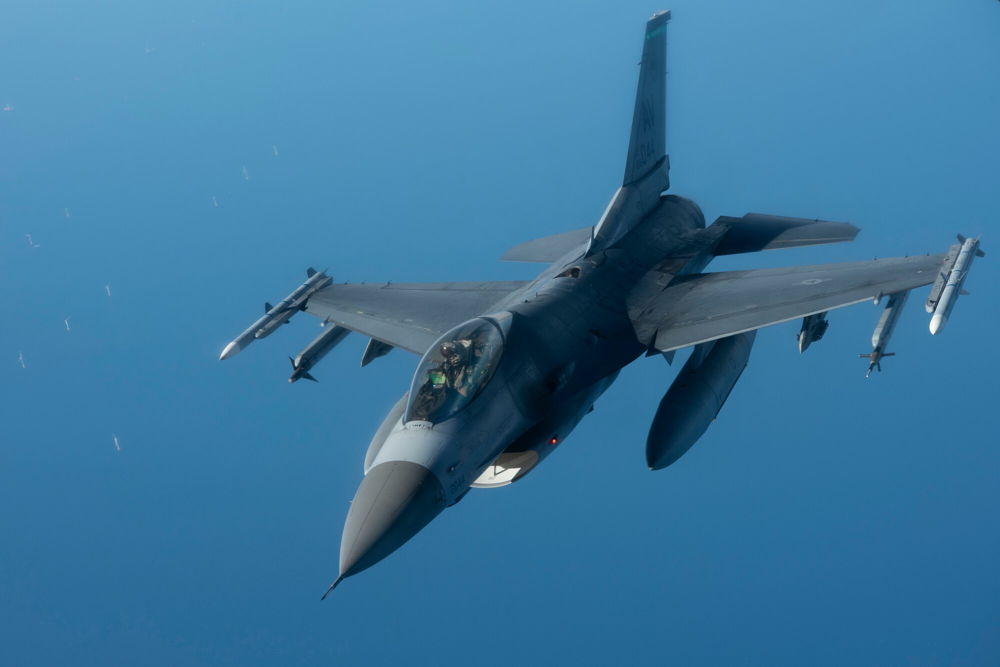 A U.S. Air Force F-16C Fighting Falcon aircraft assigned to the 31st Fighter Wing departs after receiving fuel from a KC-135 Stratotanker aircraft assigned to the 100th Air Refueling Wing over the North Sea during exercise Cobra Warrior 22, Sept. 21, 2022. The partnerships created through recurring training events like Cobra Warrior, better support the ability to employ a strategic force in theater whenever called upon. (U.S. Air Force photo by Tech. Sgt. Anthony Hetlage)