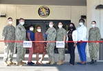 JACKSONVILLE, Fla. (Sept. 24, 2022) – Capt. Sharon House, Naval Hospital Jacksonville director and Navy Medicine Readiness and Training Command Jacksonville commander, together with the command’s Military Health System (MHS) GENESIS team, prepare to cut the ceremonial ribbon for the new electronic health record system MHS GENESIS on September 24 at the hospital.  The ribbon cutting recognized the launch of the new electronic health record at the hospital and its Naval Branch Health Clinics Jacksonville, Key West and Mayport.  (U.S. Navy photo by Yan Kennon, Naval Hospital Jacksonville/Released).