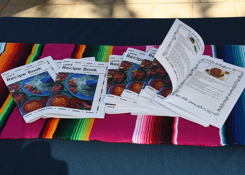 The base observes the month-long event by handing out a Hispanic Heritage Month cookbooks.