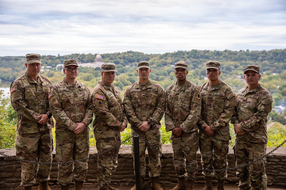 Graduates from the Kentucky Army National Guard's Officer Candidate School at the overlook near Daniel Boone's grave site at the Frankfort Cemetary in Frankfort, Ky. on Sept. 24, 2022. The graduates will be commissioned as second lieutenants in a later ceremony by friends and family. (U.S. Army photo by Andy Dickson).