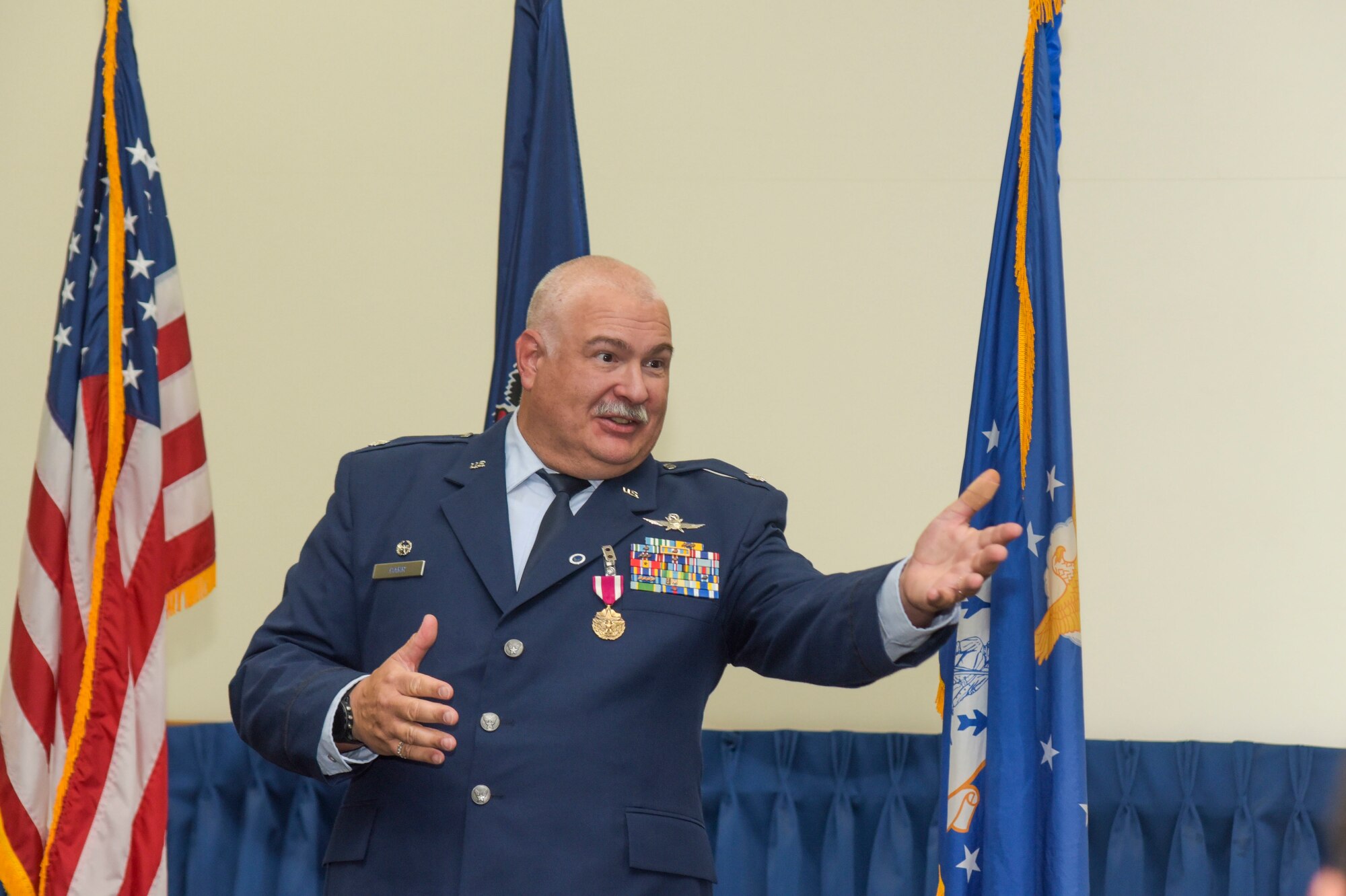 A man in Air Force Dress blues talks.