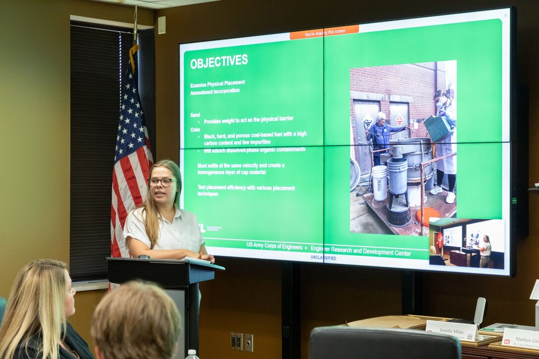 Jesseca Alexander, U.S. Army Corps of Engineers, Kansas City District civil engineer, presents her research project, which focused on Unconfined Sediment Placement Tests to determine better placement methods and material selection to reduce the problems associated with placing mixtures of sand and amendments, during the ERDC-U graduation on Sept. 15, 2022, in Vicksburg, Mississippi. Photo by Patrice Creel, U.S. Army Engineer Research and Development Center.