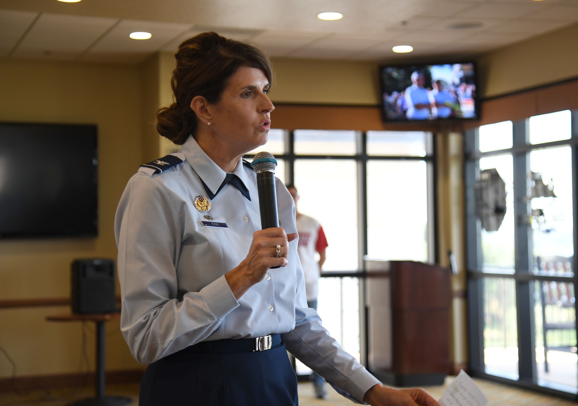 U.S. Air Force Col. Laura King, 81st Training Group commander, delivers remarks during the Hispanic Heritage Month event inside the Bay Breeze Event Center at Keesler Air Force Base, Mississippi, Sept. 23, 2022. Dominos and dance lessons were offered during the event. Hispanic Heritage Month is celebrated September 15 through October 15. (U.S. Air Force photo by Kemberly Groue)