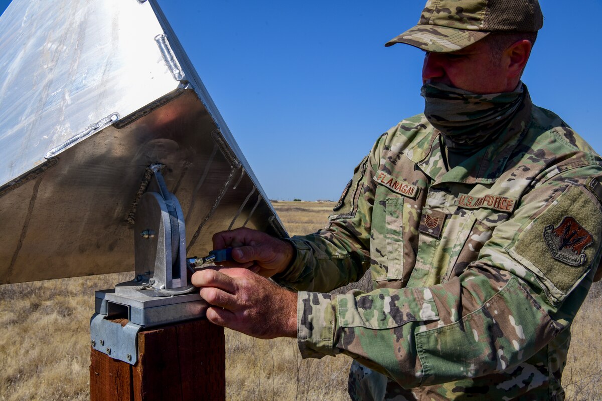 Tech. Sgt. Kevin Flanagan adjust the radar reflector for Beale radar test range at July 26, 2022, at Beale Air Force Base, California. The reflector is capable of rotating to any orientation of flight plan. (U.S Air Force photo by Staff Sgt. Colville McFee)