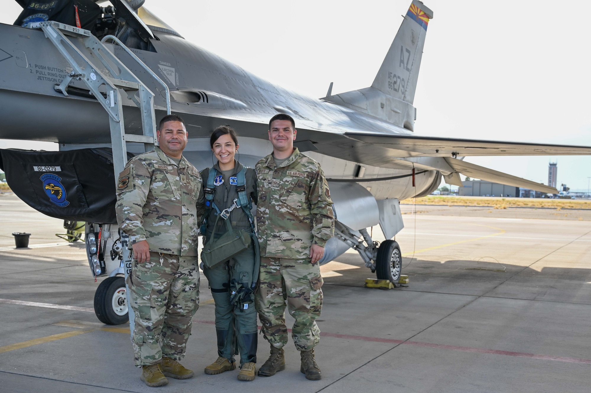 “Family is everything to us. It’s what makes us do what we do,” said Master Sgt. Raul Basurto, Jr., left. Basurto and his son, Raul Basurto III, right, work on the F-16s that their cousin, 1st Lt. Alyssa Majuta, flies at the Morris Air National Guard Base in Tucson, Arizona. (U.S. Air National Guard photo by Maj. Angela Walz)