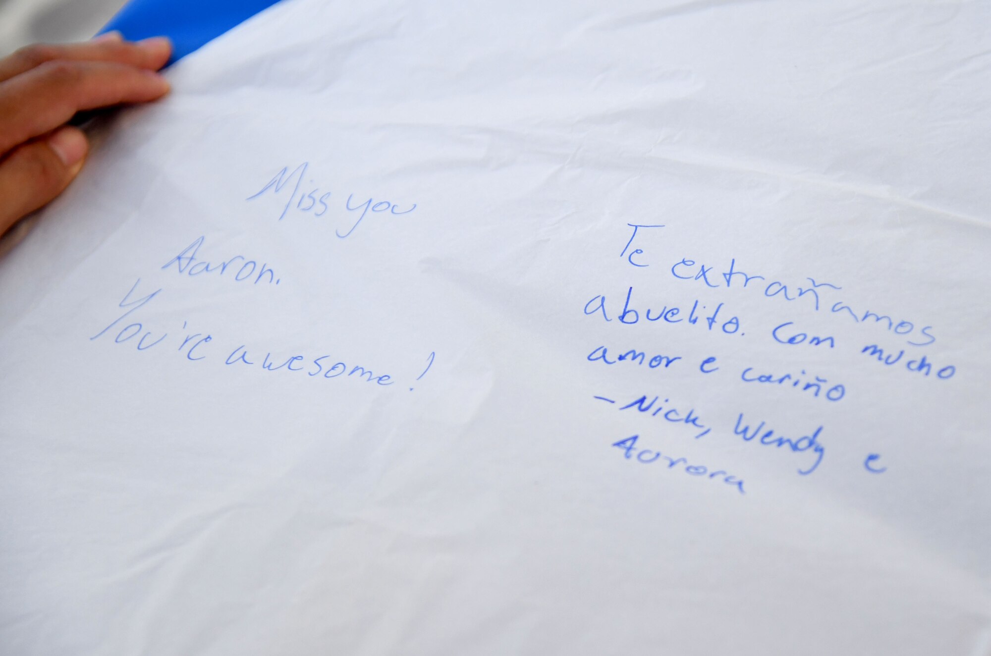 U.S. Air Force Staff Sgt. Nick Dominguez, 334th Training Squadron curriculum developer, writes a message on a lantern during the Gold Star Families Sky Lantern Release on the Biloxi Beach, Mississippi, Sept. 23, 2022. The event, hosted by Keesler Air Force Base, included eco-friendly sky lanterns released in honor of fallen heroes. (U.S. Air Force photo by Kemberly Groue)