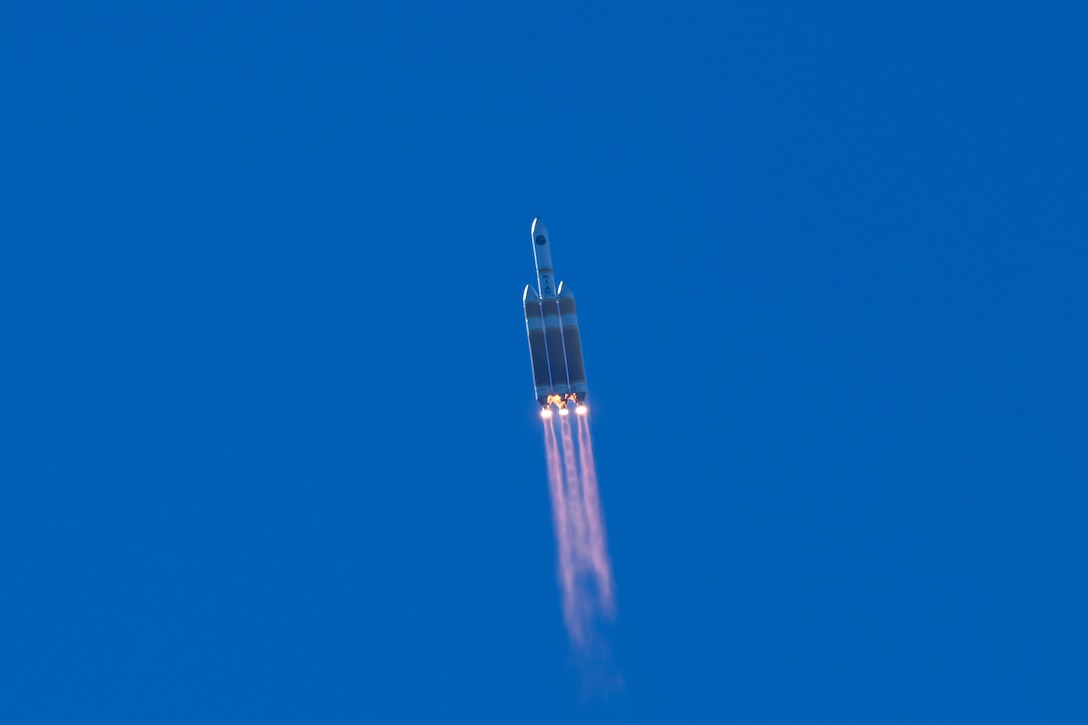 A rocket launches in the sky.